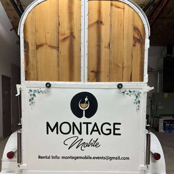Montage Mobile wine bar trailer with a white base, wooden top, and Montage logo.
